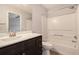 Bright bathroom with shower and tub combination, sleek fixtures, and marble countertop at 1310 Kilmington Ct, Alpharetta, GA 30009