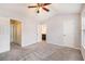 Expansive bedroom with ceiling fan, neutral walls, and multiple closets and ensuite bathroom at 1310 Kilmington Ct, Alpharetta, GA 30009
