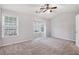 Spacious bedroom features large windows and plush carpet creating a cozy atmosphere at 1310 Kilmington Ct, Alpharetta, GA 30009