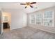 Spacious bedroom featuring vaulted ceiling, ceiling fan, natural light, and an ensuite bathroom at 1310 Kilmington Ct, Alpharetta, GA 30009