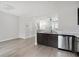 Bright kitchen with stainless steel appliances, dark wood cabinets and marble countertop at 1310 Kilmington Ct, Alpharetta, GA 30009