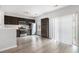 Modern kitchen with stainless steel appliances, dark cabinetry, and sliding glass doors for natural light at 1310 Kilmington Ct, Alpharetta, GA 30009