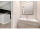 Charming powder room boasts modern vanity, framed mirror, and stylish fixtures at 1310 Kilmington Ct, Alpharetta, GA 30009