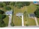 Aerial view of the property showcasing the house, landscaping, and surrounding neighborhood at 472 Linda Ln, Powder Springs, GA 30127