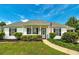 Charming single-story home with landscaped front yard and cozy covered porch, complete with an American flag at 472 Linda Ln, Powder Springs, GA 30127