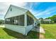 Exterior shot of a screened-in back porch, perfect for enjoying the outdoors while protected from insects at 472 Linda Ln, Powder Springs, GA 30127