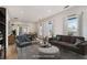 Staged living room with comfortable seating, accent furniture, and natural light at 953 Michigan Ave, Atlanta, GA 30314