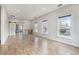 Bright living room featuring beautiful wood floors and ample natural light from large windows at 953 Michigan Ave, Atlanta, GA 30314