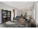 Staged living room and dining area featuring a bookshelf, modern furniture and decor at 953 Michigan Ave, Atlanta, GA 30314