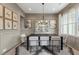 Elegant dining room featuring stylish decor, a large window, and a contemporary lighting fixture at 3345 Hillshire Dr, Cumming, GA 30028