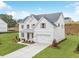 Beautiful two-story home featuring brick and siding, complemented by a well-maintained lawn and driveway at 3345 Hillshire Dr, Cumming, GA 30028