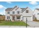 Charming two-story home with white brick and manicured lawn, complete with a two-car garage at 3345 Hillshire Dr, Cumming, GA 30028
