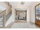 Elegant foyer with hardwood floors, a staircase, and an open view into the dining room at 3345 Hillshire Dr, Cumming, GA 30028