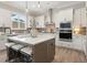 Contemporary kitchen with stainless steel appliances, center island with seating, and plenty of storage at 3345 Hillshire Dr, Cumming, GA 30028