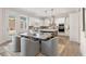 Eat-in kitchen area showcases modern appliances, a center island, and ample natural light, perfect for Gathering dining at 3345 Hillshire Dr, Cumming, GA 30028