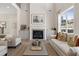 Living room boasts a fireplace, built-in cabinets, and a neutral color scheme with comfortable seating at 3345 Hillshire Dr, Cumming, GA 30028