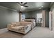 Spacious bedroom featuring a chaise lounge, ceiling fan, and two large windows at 3345 Hillshire Dr, Cumming, GA 30028