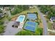 Aerial view of community pool, tennis courts, and playground at 681 Braidwood Nw Ter, Acworth, GA 30101
