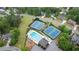 Aerial view of community amenities: swimming pool and tennis courts at 681 Braidwood Nw Ter, Acworth, GA 30101