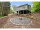 Home exterior featuring a firepit, backyard and deck at 681 Braidwood Nw Ter, Acworth, GA 30101