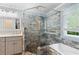 Stylish bathroom with walk-in shower, modern fixtures, and soaking tub at 681 Braidwood Nw Ter, Acworth, GA 30101