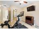 Bright exercise room with hardwood floors and Peloton bike visible from the doorway at 681 Braidwood Nw Ter, Acworth, GA 30101