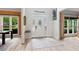 Bright foyer with decorative door, light hardwood floors, and transom window at 681 Braidwood Nw Ter, Acworth, GA 30101