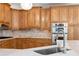 A traditional style kitchen offers stainless steel appliances, custom cabinetry, and marble countertops at 681 Braidwood Nw Ter, Acworth, GA 30101