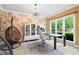 Stylish office with large windows, patterned wallpaper, and unique furniture at 681 Braidwood Nw Ter, Acworth, GA 30101