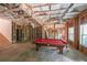 Unfinished basement with exposed ceiling and structural framing featuring a pool table at 8090 Tristan Way, Whitesburg, GA 30185