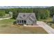 Charming new construction with a welcoming front porch and stone facade at 8090 Tristan Way, Whitesburg, GA 30185