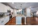 Stylish kitchen with stainless steel appliances, granite countertops, and a large center island at 8090 Tristan Way, Whitesburg, GA 30185