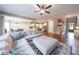 Spacious living room featuring hardwood floors, a ceiling fan, and an open floor plan at 8090 Tristan Way, Whitesburg, GA 30185