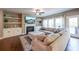Cozy living room featuring a fireplace, built-in cabinets, and plush sofa seating at 8090 Tristan Way, Whitesburg, GA 30185