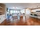 Open-concept living room and kitchen with modern features, hardwood floors, and plenty of space for entertaining at 8090 Tristan Way, Whitesburg, GA 30185