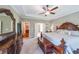 The main bedroom boasts beautiful, coordinating furniture and a neutral carpet at 8090 Tristan Way, Whitesburg, GA 30185