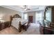 Spacious main bedroom features a tray ceiling, neutral carpet and large windows at 8090 Tristan Way, Whitesburg, GA 30185