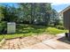 Large backyard with mature trees, shed, and stone patio perfect for outdoor living at 1954 Timothy Dr, Atlanta, GA 30329