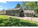 The property features a well-maintained backyard with mature trees and outdoor patio at 1954 Timothy Dr, Atlanta, GA 30329