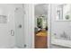 Bathroom featuring a new shower and vanity that leads into the adjacent living room at 1954 Timothy Dr, Atlanta, GA 30329