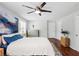 Bright bedroom featuring a ceiling fan, art, dresser and access to closet at 1954 Timothy Dr, Atlanta, GA 30329