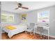 Bright bedroom features a single bed, desk, ceiling fan and natural light at 1954 Timothy Dr, Atlanta, GA 30329