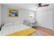 Bright bedroom featuring a single bed, desk, ceiling fan and closet space at 1954 Timothy Dr, Atlanta, GA 30329