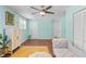 The living room features a ceiling fan, white cabinet, and access to three different doorways at 1954 Timothy Dr, Atlanta, GA 30329