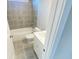 Bathroom features a shower and tub combination and modern tiling at 3355 Hillshire Dr, Cumming, GA 30028