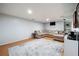 Spacious basement with a large sectional sofa and decorative rug at 706 Briarleigh Sw Ct, Mableton, GA 30126
