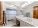 Bathroom featuring a single sink, shower with curtain, and tile flooring at 706 Briarleigh Sw Ct, Mableton, GA 30126