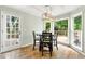 Breakfast nook with deck access, large windows and modern chandelier at 706 Briarleigh Sw Ct, Mableton, GA 30126