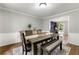 Spacious dining room featuring wood floors, a dining table, and an adjacent study at 706 Briarleigh Sw Ct, Mableton, GA 30126