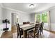 Formal dining room with wood table, and decorative lighting, perfect for gatherings at 706 Briarleigh Sw Ct, Mableton, GA 30126